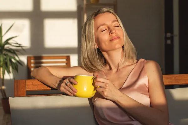 Woman relaxing with cup of tea
