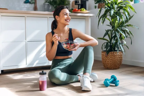 Woman Eating Bowl of Food