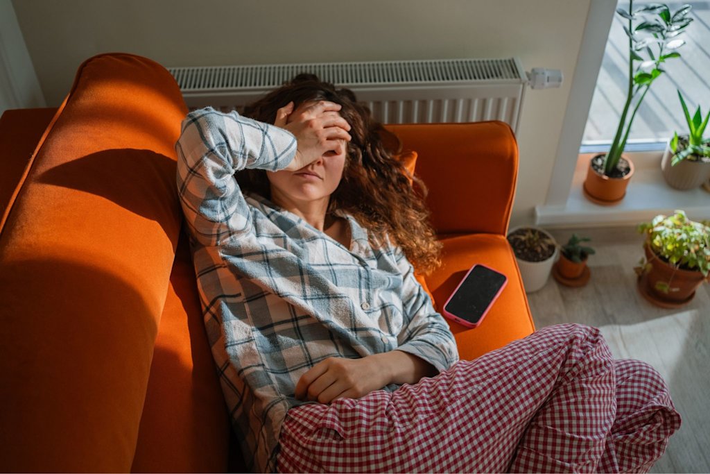 Woman tired on couch
