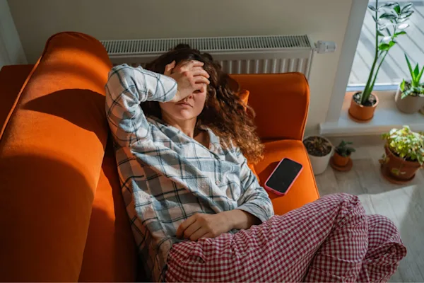 Woman tired on couch