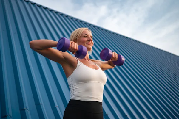 Woman dumbbell high row