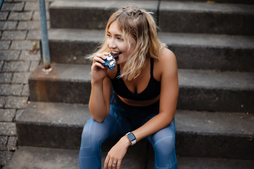 Woman eating protein bar