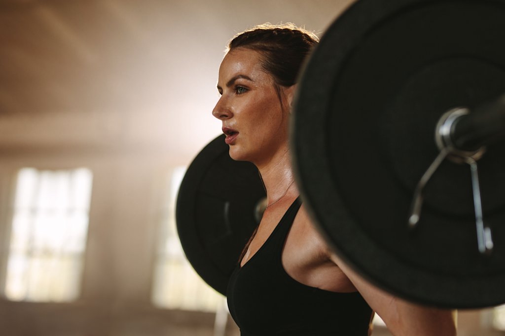 Close up woman back squatting