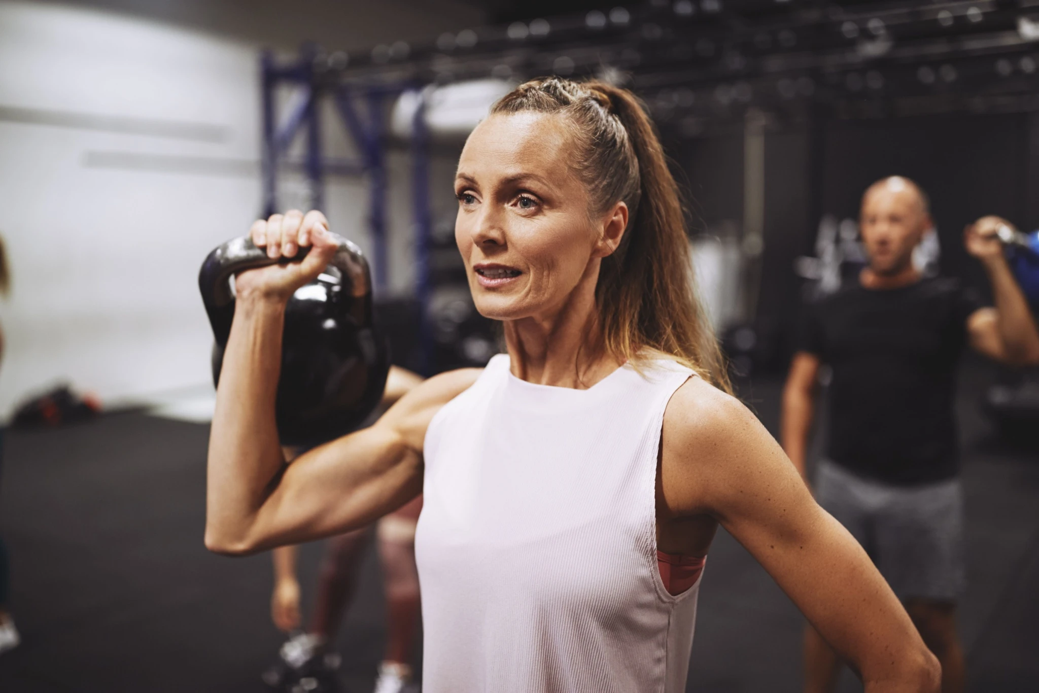 Woman holding kettlebell