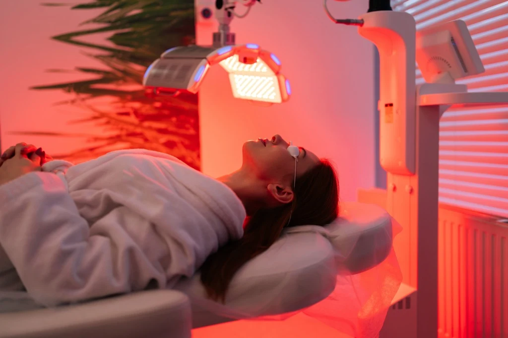 Woman doing red light therapy