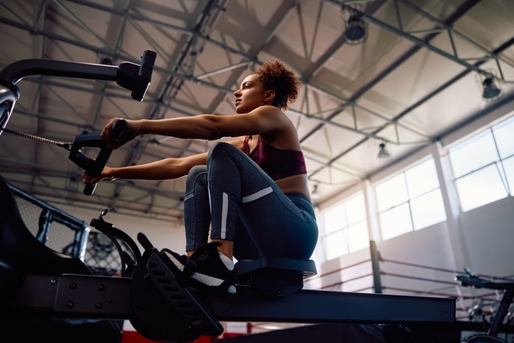 Woman on rowing erg