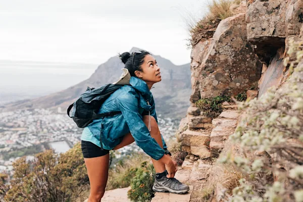 Woman hiking up mountain