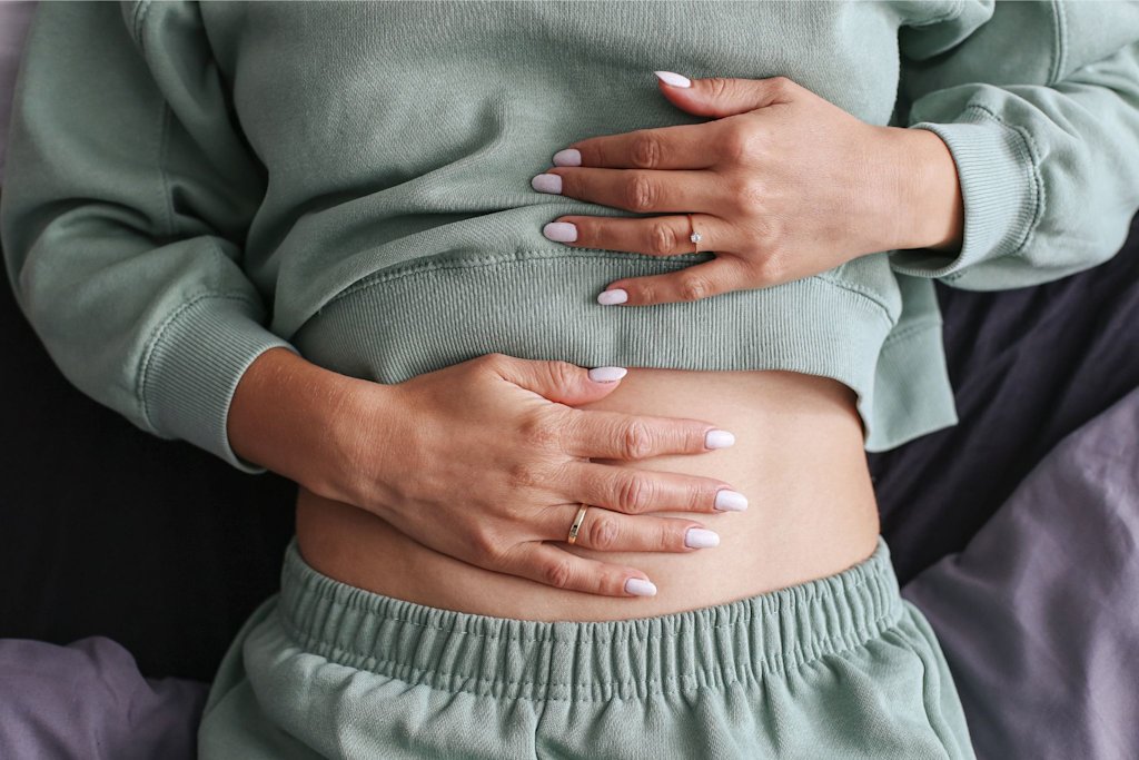Woman holding stomach