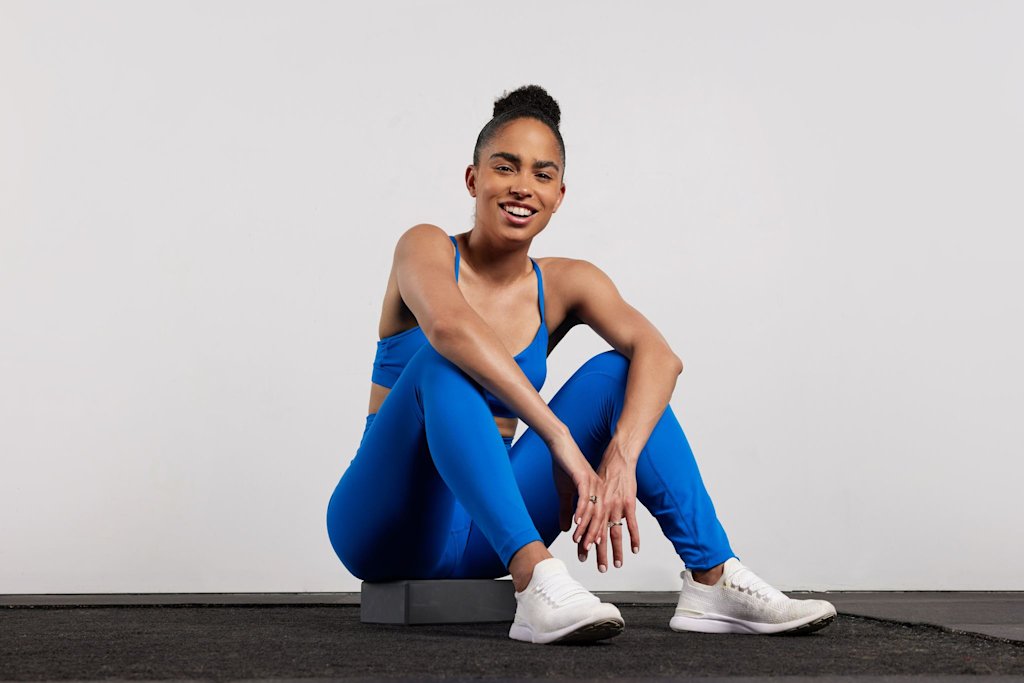 Britany Williams seated in blue