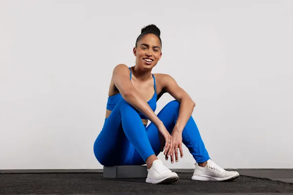 Britany Williams seated in blue