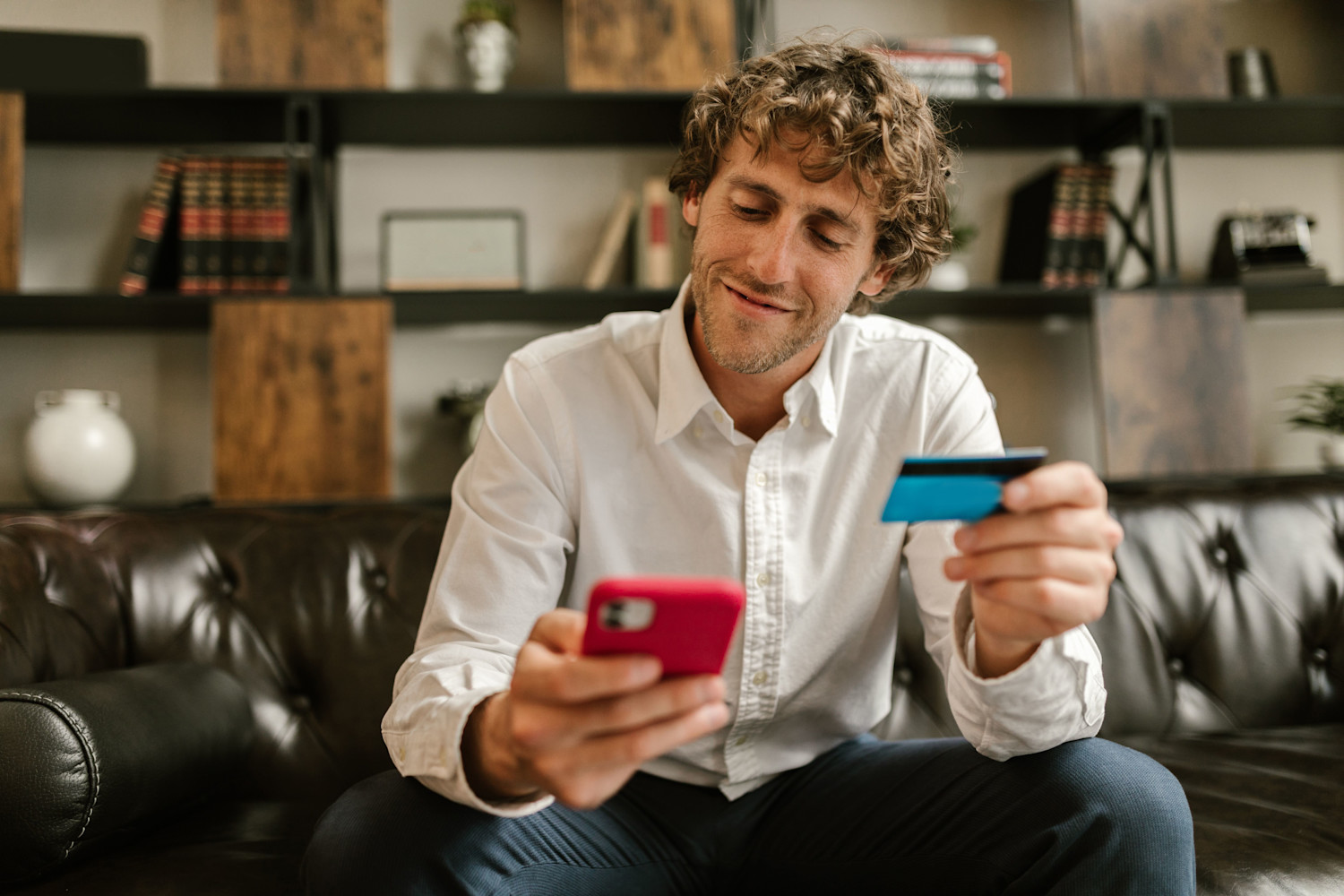 man with phone and card