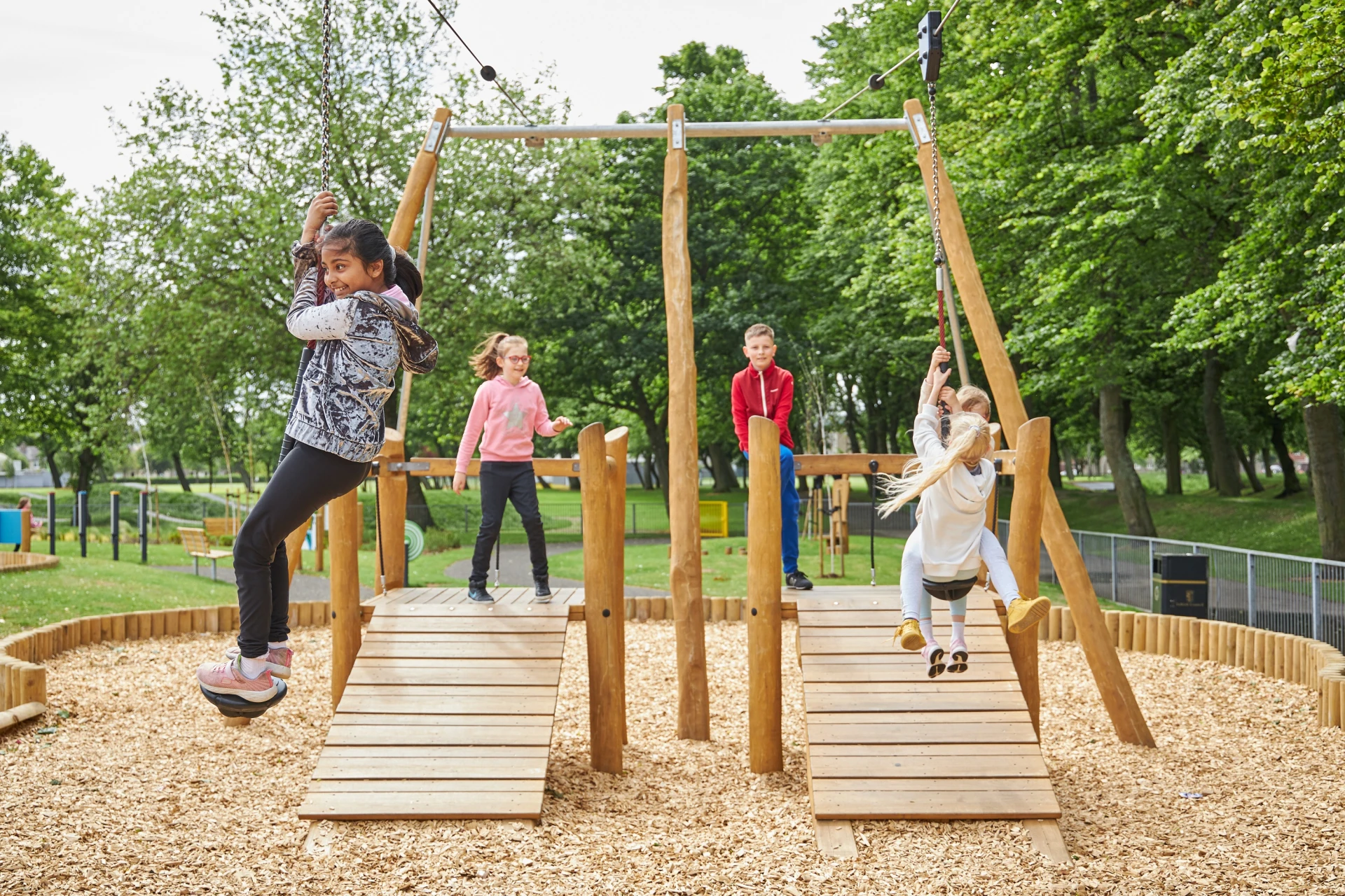 Children playing on robinia wood cableways