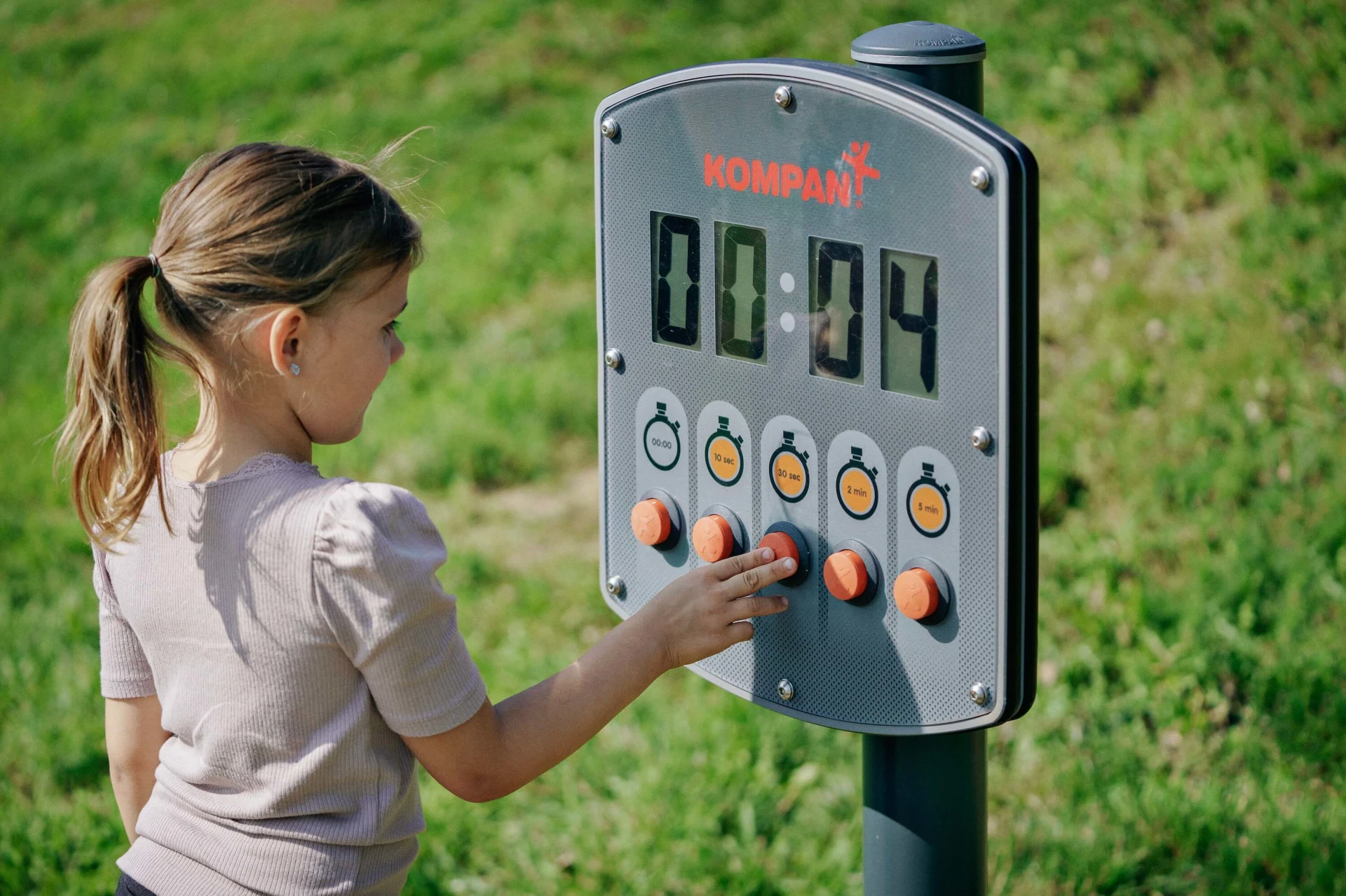 A child playing with an electronic outdoor play timer