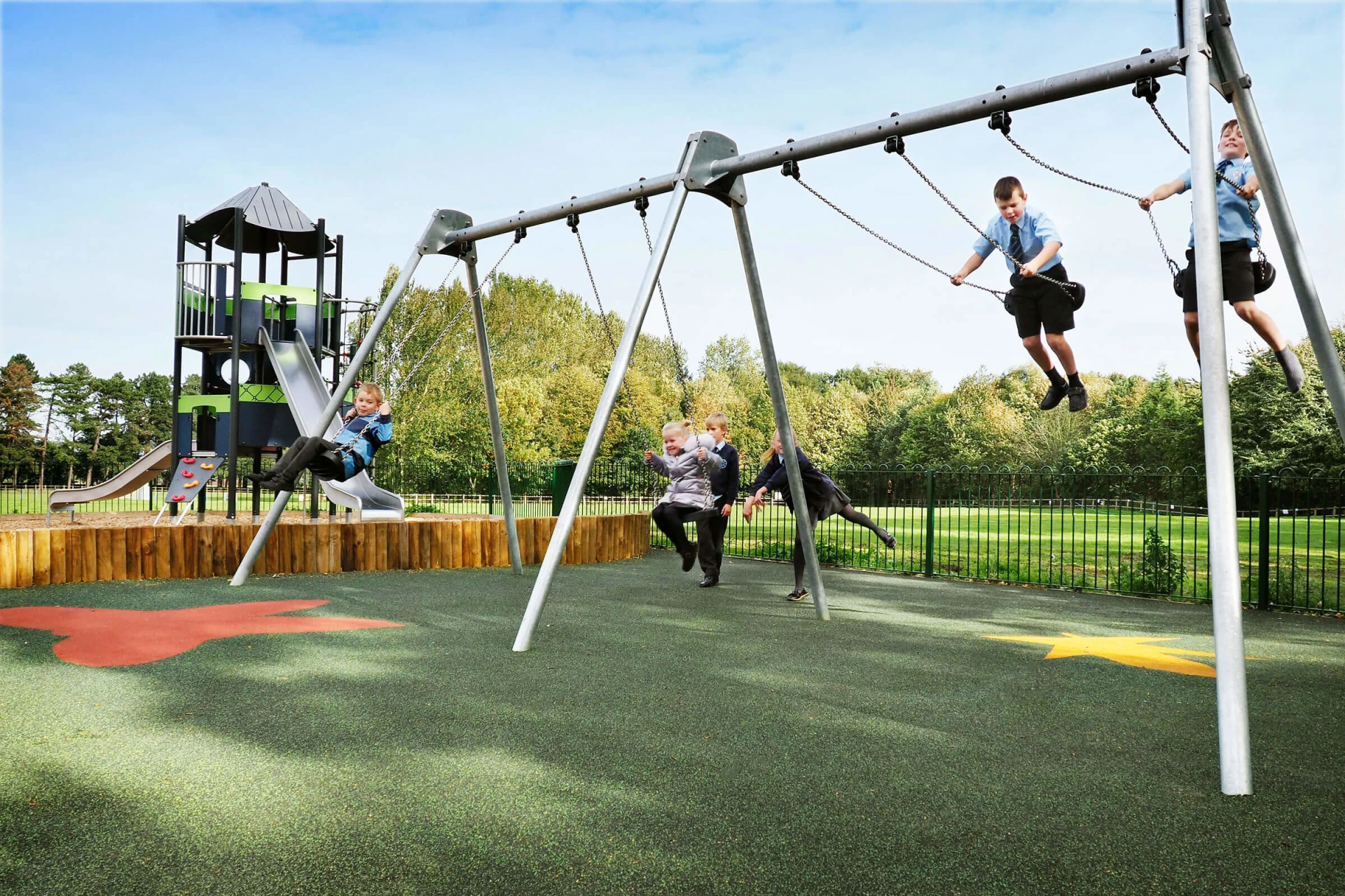 Children swinging on playground at Normanby Hall Country Park