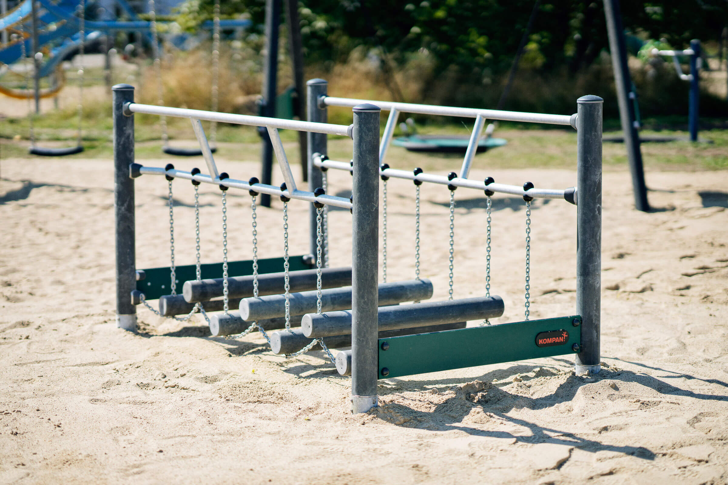 Sway alley balancing playground equipment with posts made of textile waste