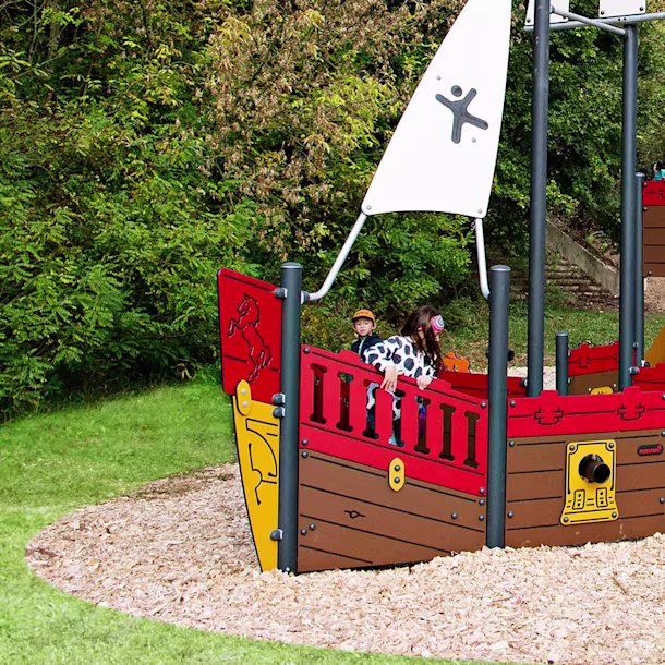 hero image of children playing in a park on a playground ship