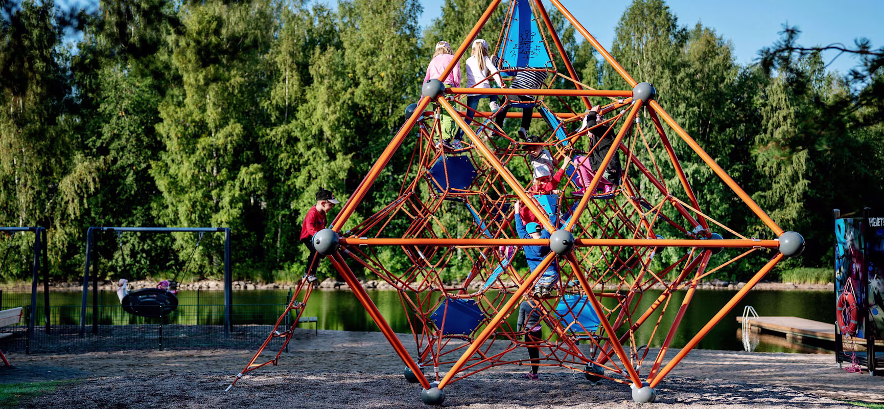 Framenet with children climbing at Varkaus Activity Areas in Finland
