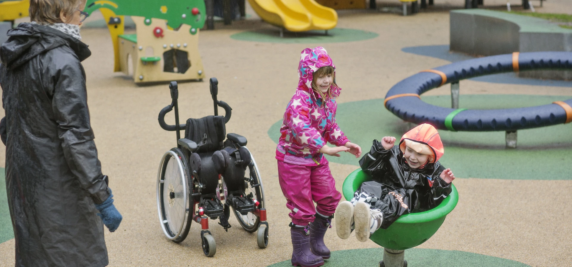 How to make an inclusive playground? Boy spinning in a spinnerbowl