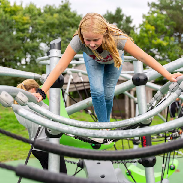 girl climbing on GALAXY play system for teens at Hældager School