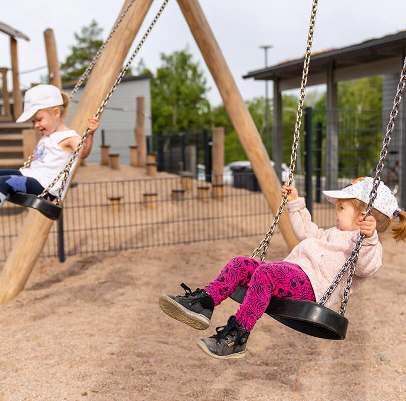 robinia swings category reference image children playing on wooden swings