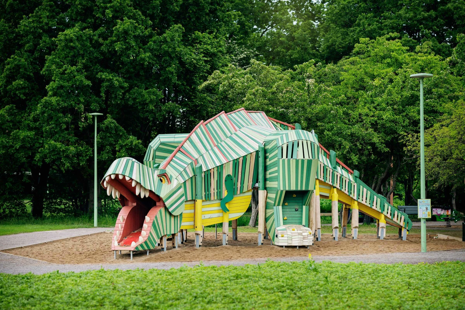 Natural wood dinosaur playground