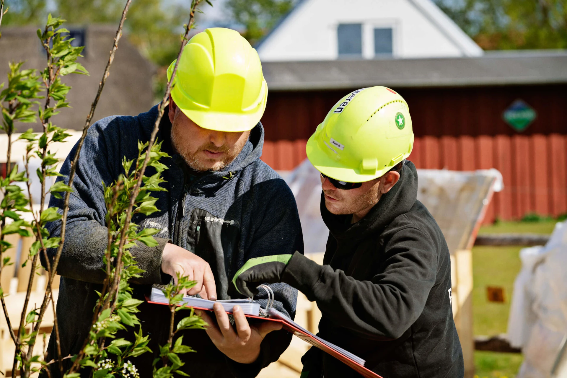 Closeup of workers visiting a playground site pre-installation