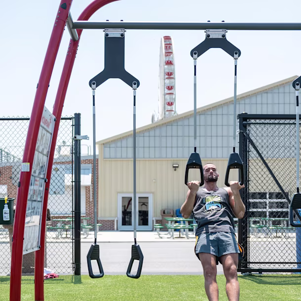 people using an outdoor park gym for functional fitness training hero image