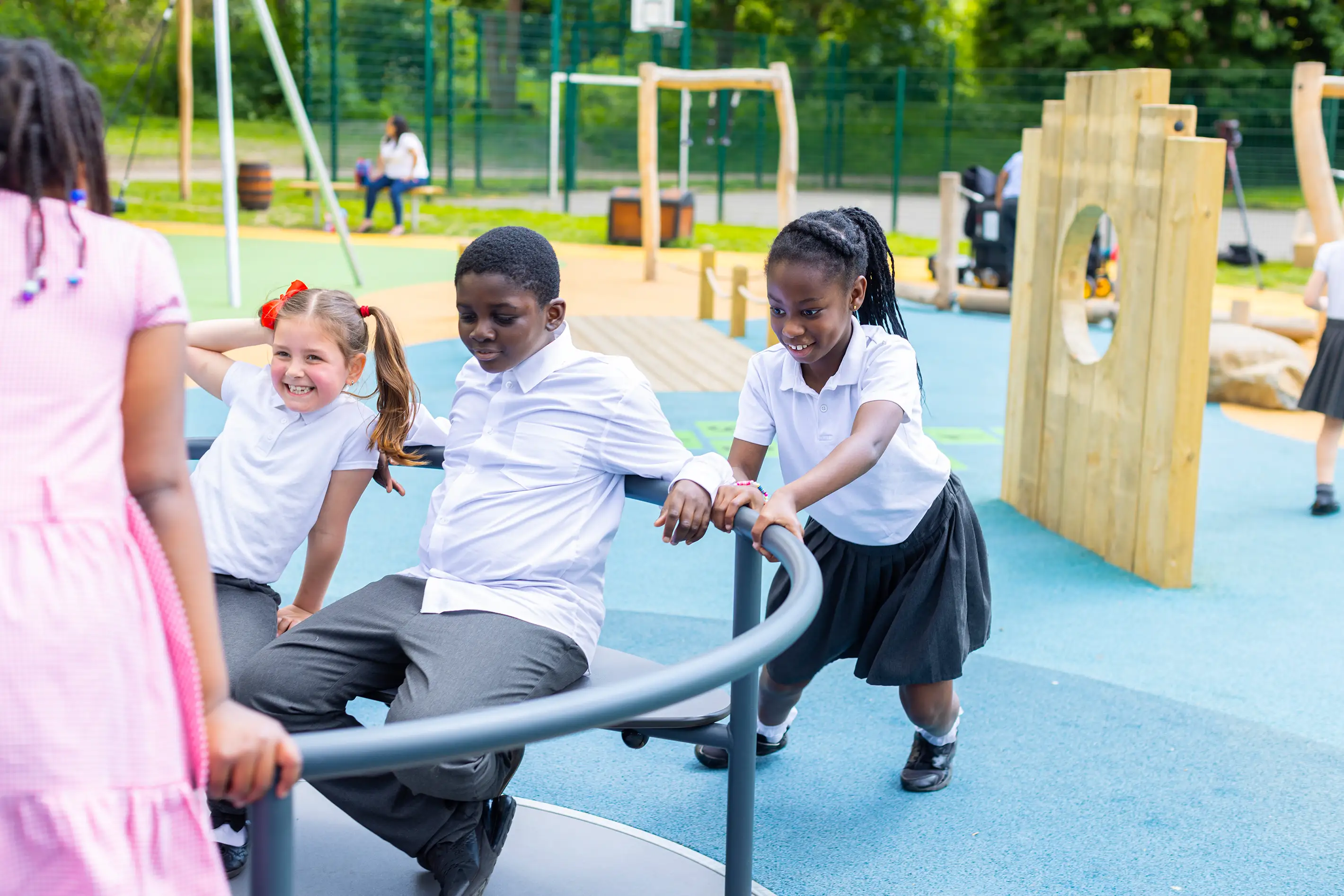 children playing on a wooden playground structure at Boyd Hill