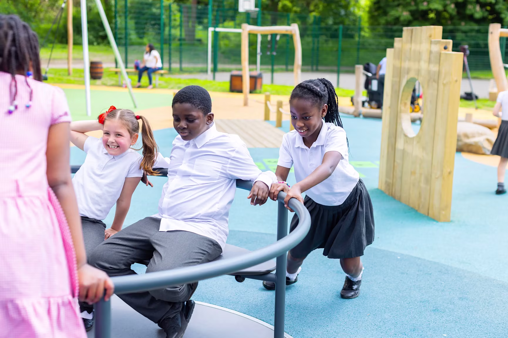 children playing on a wooden playground structure at Boyd Hill
