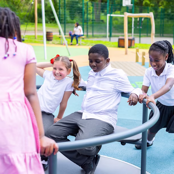 children playing on a wooden playground structure at Boyd Hill