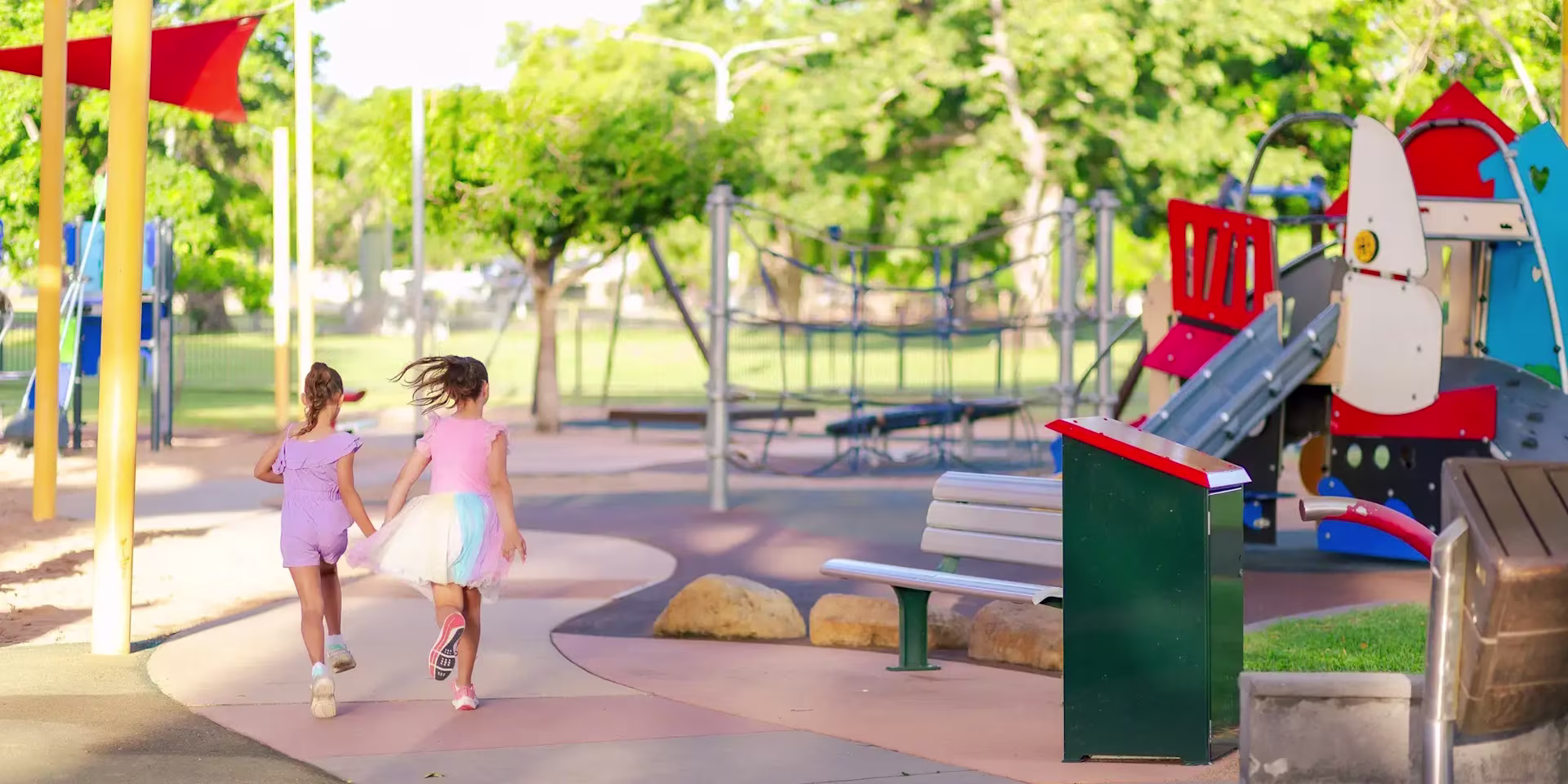 children playing on a wooden playground structure at Boyd Hill
