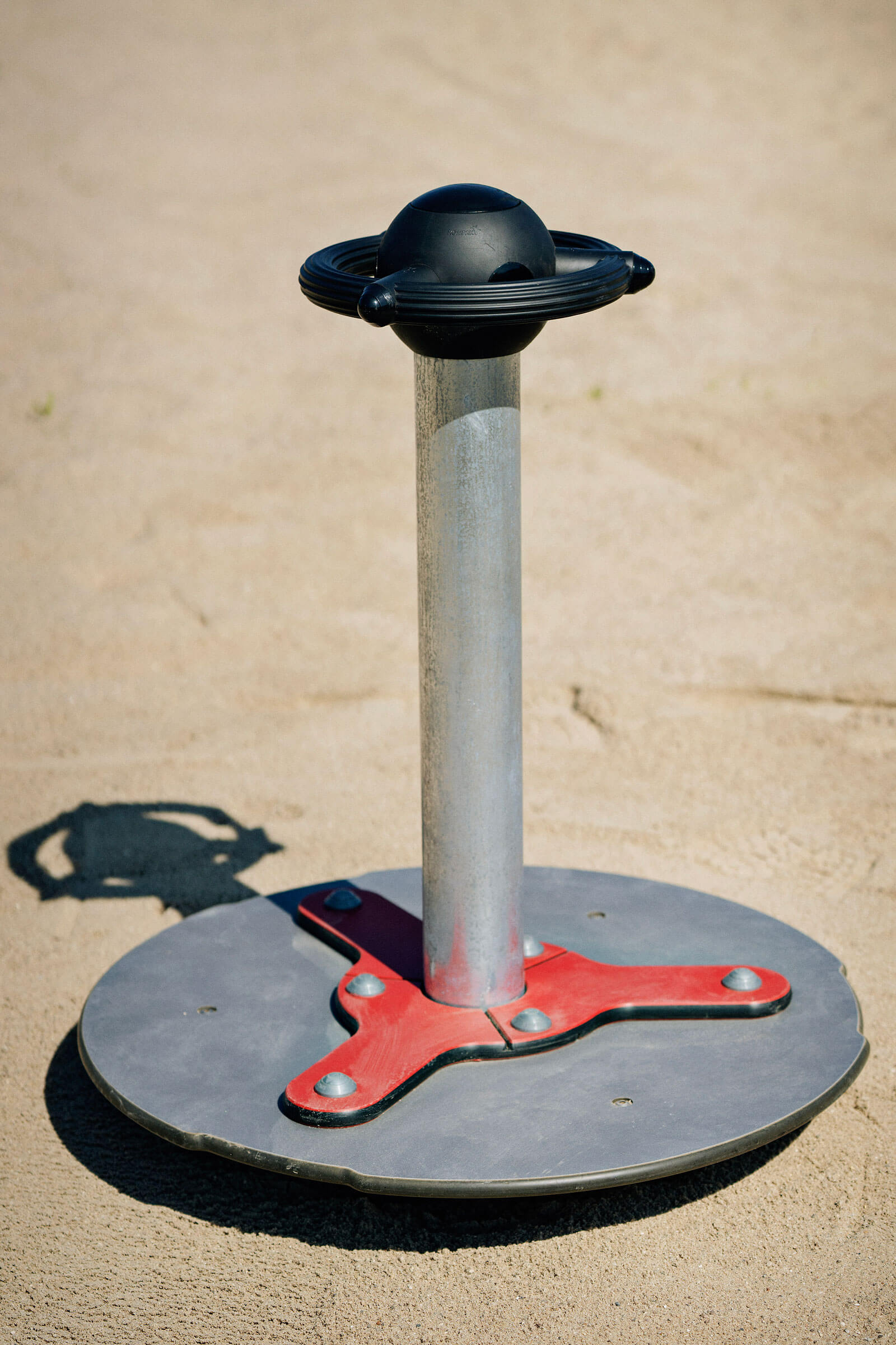 Closeup of scooter carousel playground product from KOMPAN