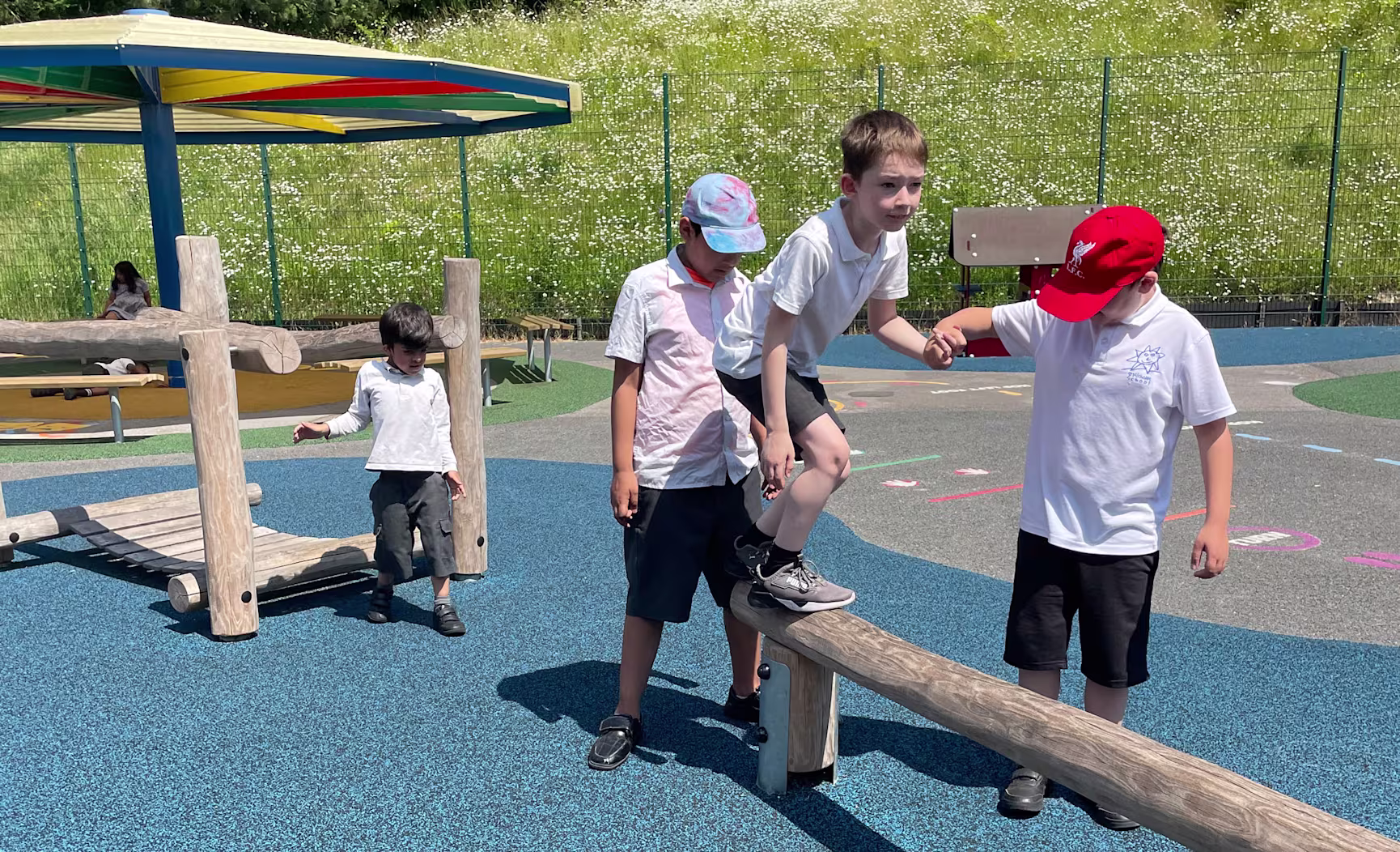 two girl climbing on playground equipment in a park