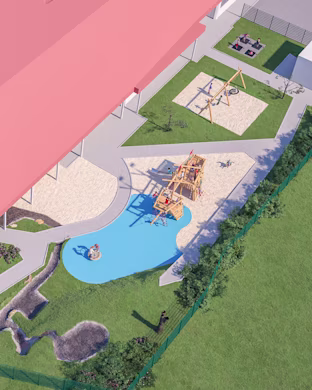 Aerial view of a colourful playground with wooden climbing structures, sandpits, blue play surface and surrounding grass and paths