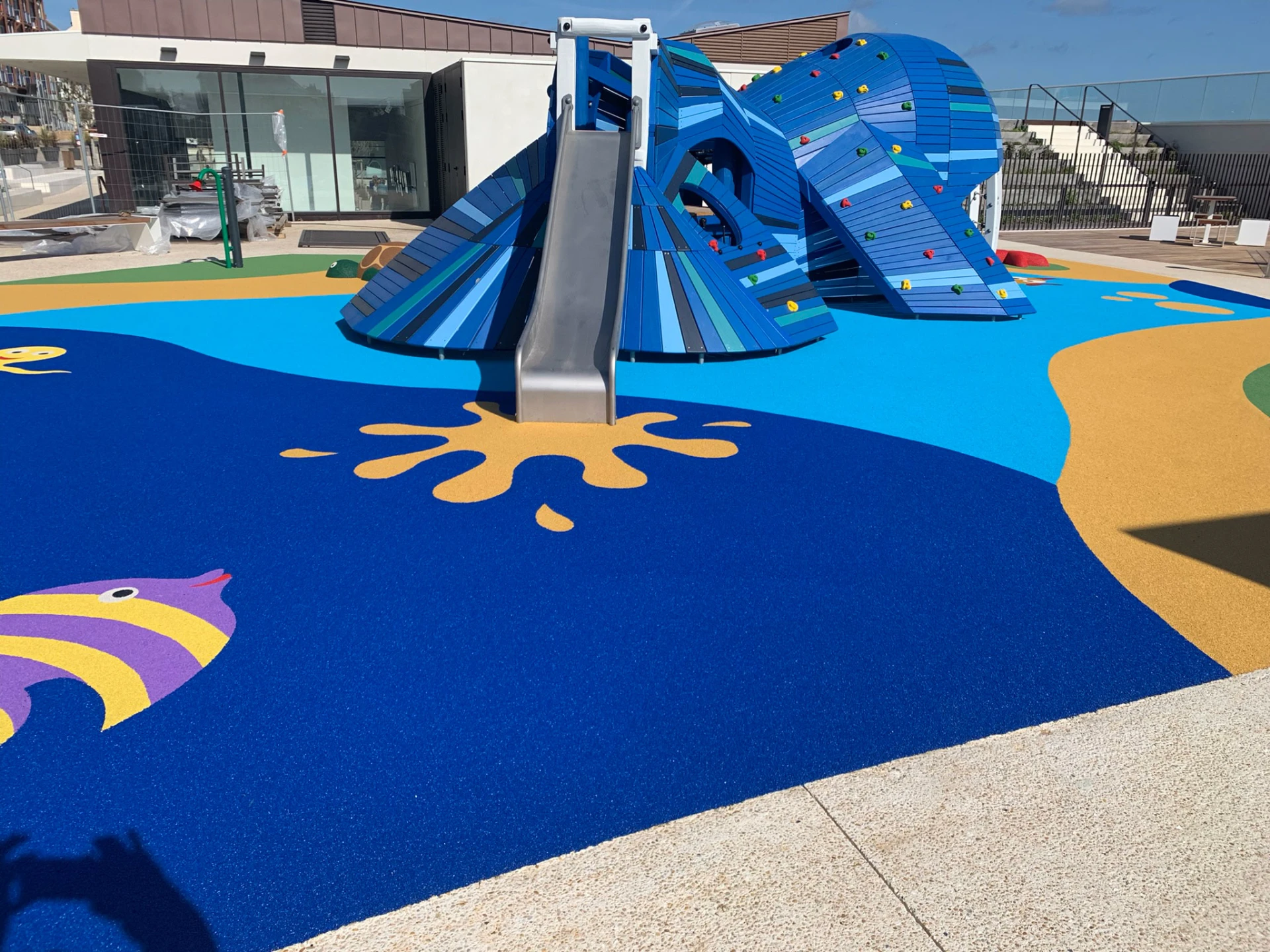 Water themed playground surfacing with fish