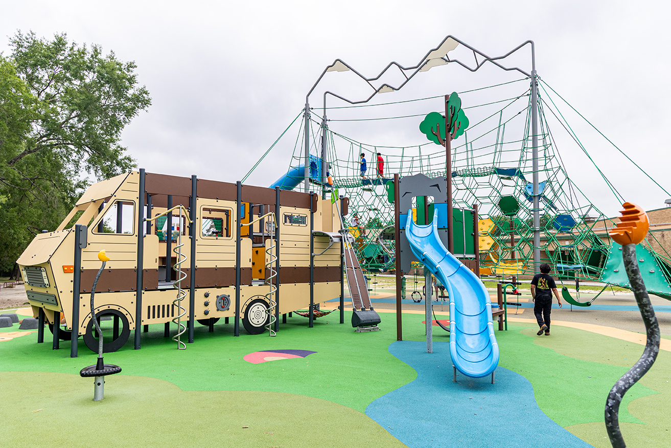 Colorful outdoor playground with KOMPAN Climbing Net Structure
