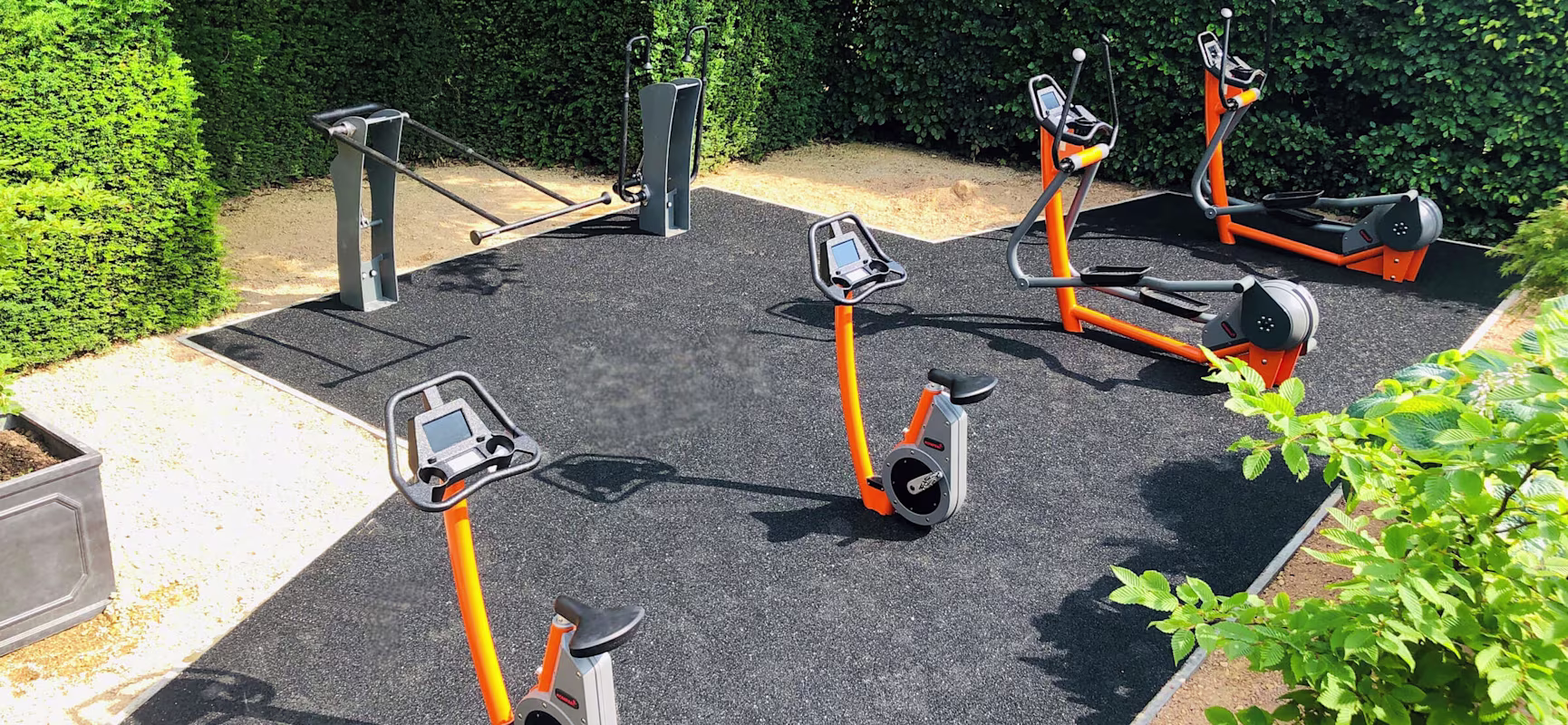 outdoor fitness area with stationary cardio equipment