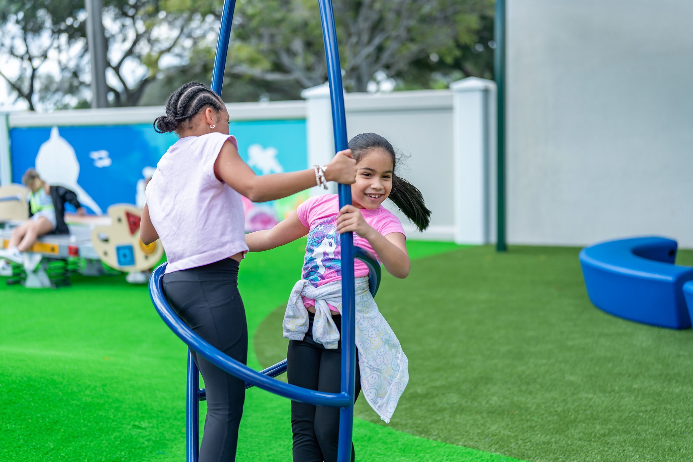Center for creative education - Two girls spinning around