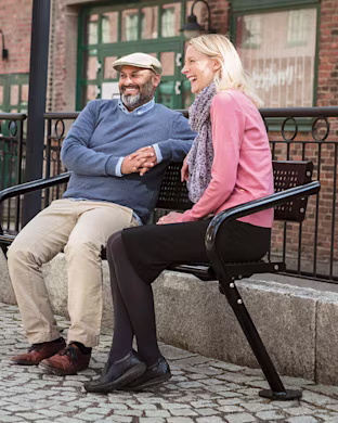 man-and-woman-sitting-in-outdoor-furniture-for-parks