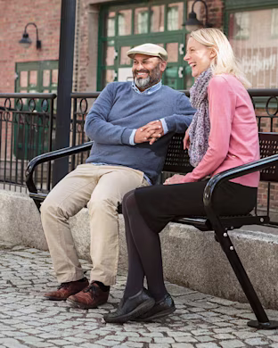 man-and-woman-sitting-in-outdoor-furniture-for-parks