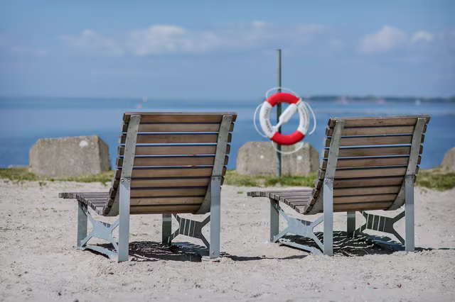outdoor furniture people sitting on park equipment bench