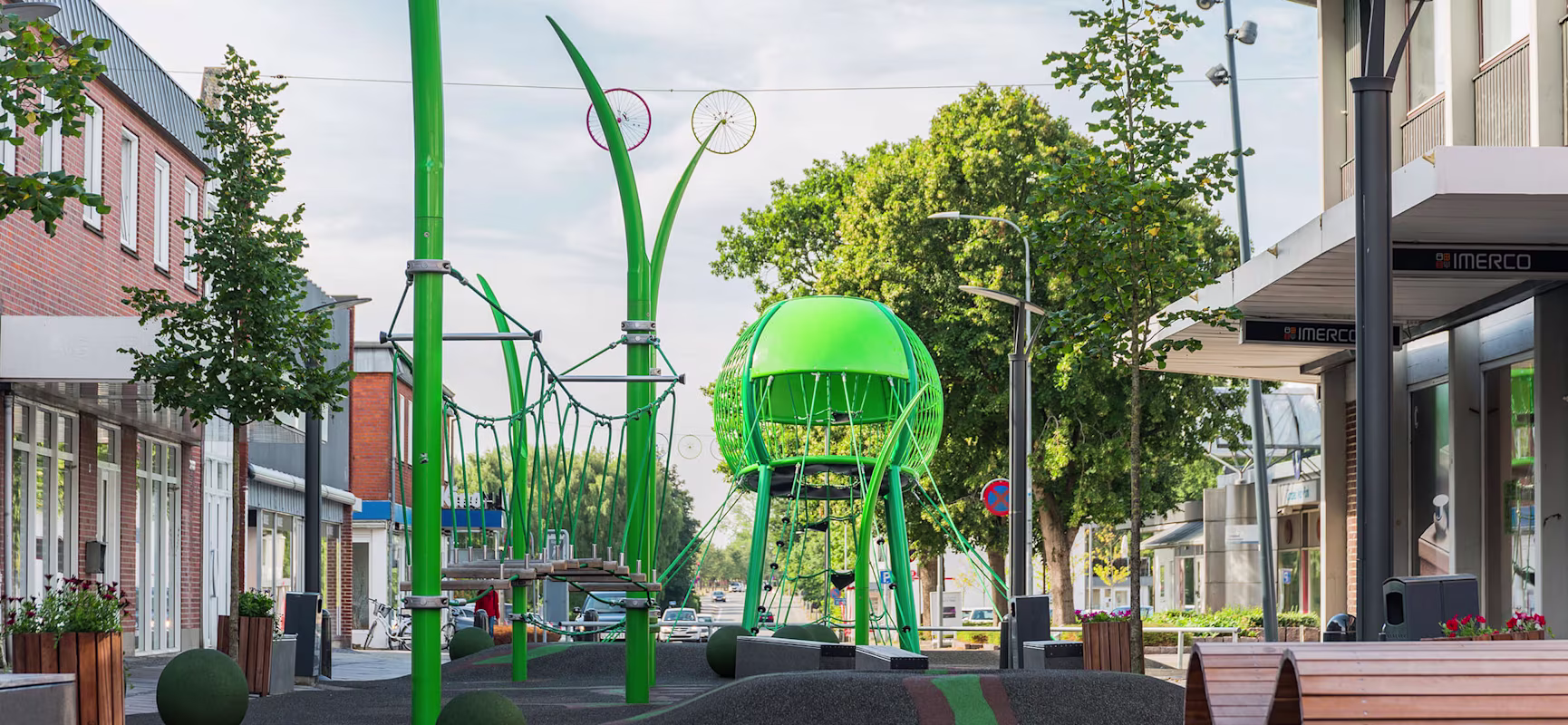 Grindsted city shopping street with rope climbing playground tower