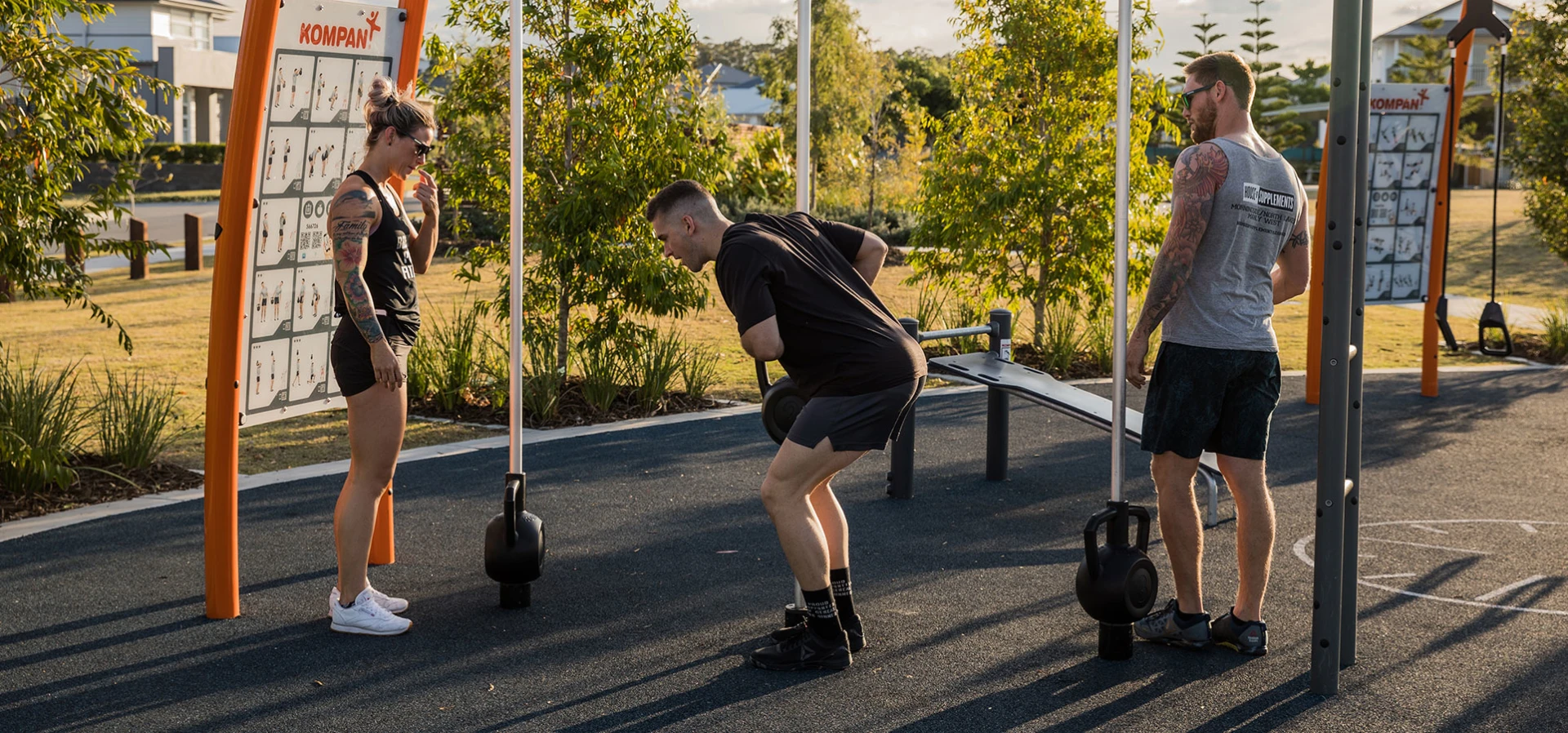 People working out with an outdoor kettlebell system