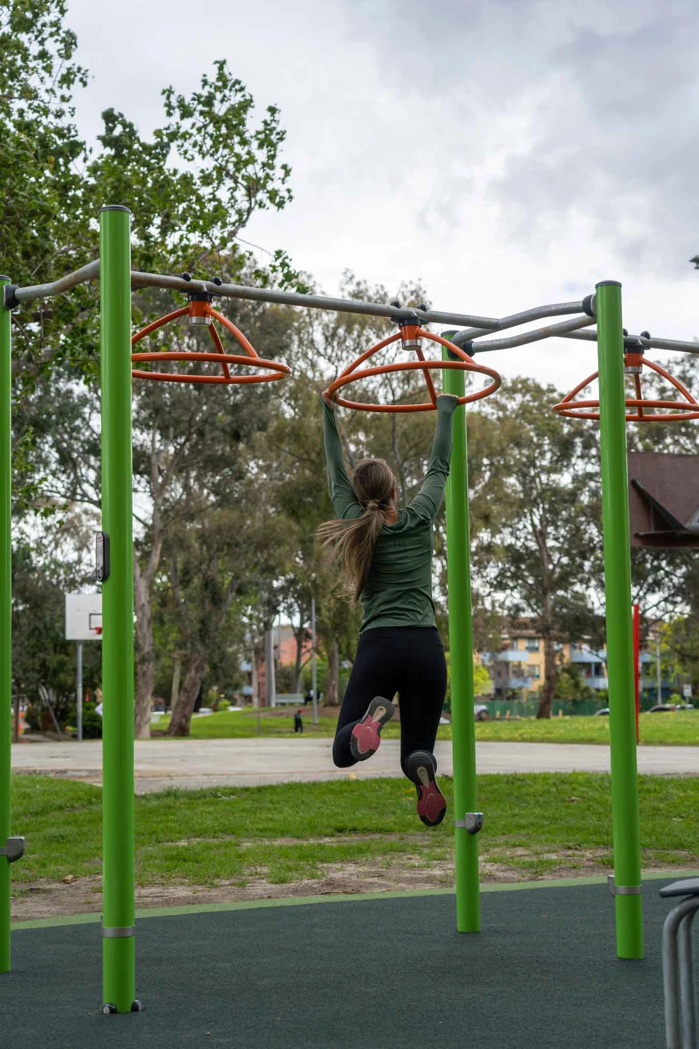 woman working out in an outdoor gym