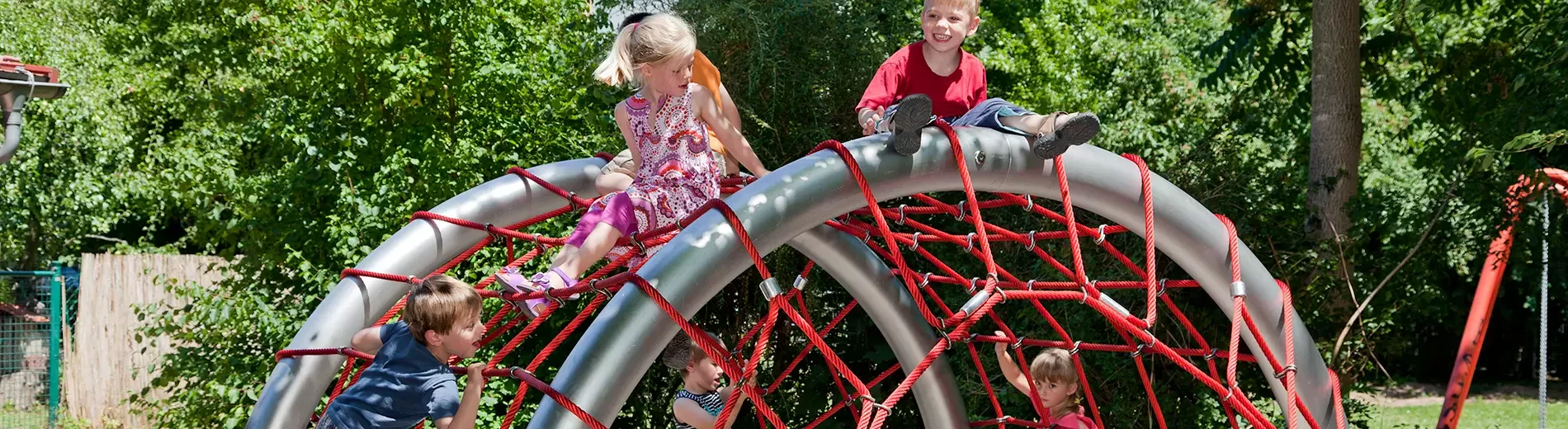 small young children climbing on a rope playground for toddlers hero image