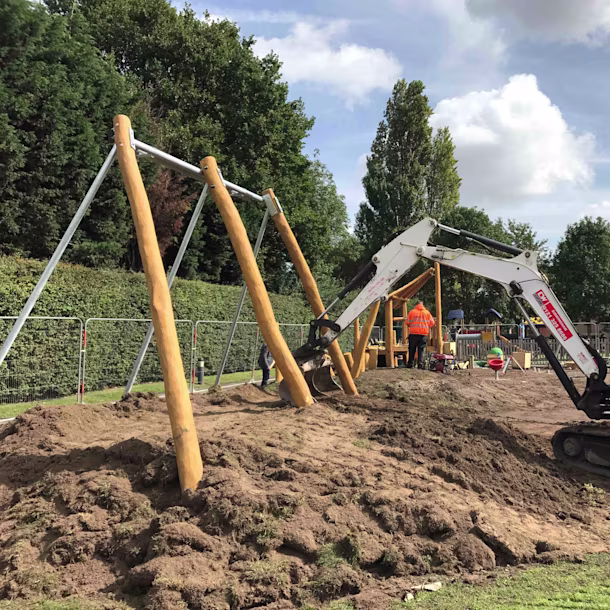Split image of a schoolyard before and after renovation, showing a plain grey court versus a colourful playground with equipment