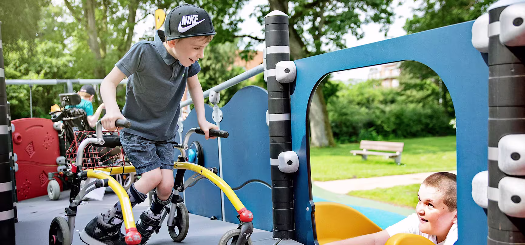 hero image of inclusive children playing on a play tower