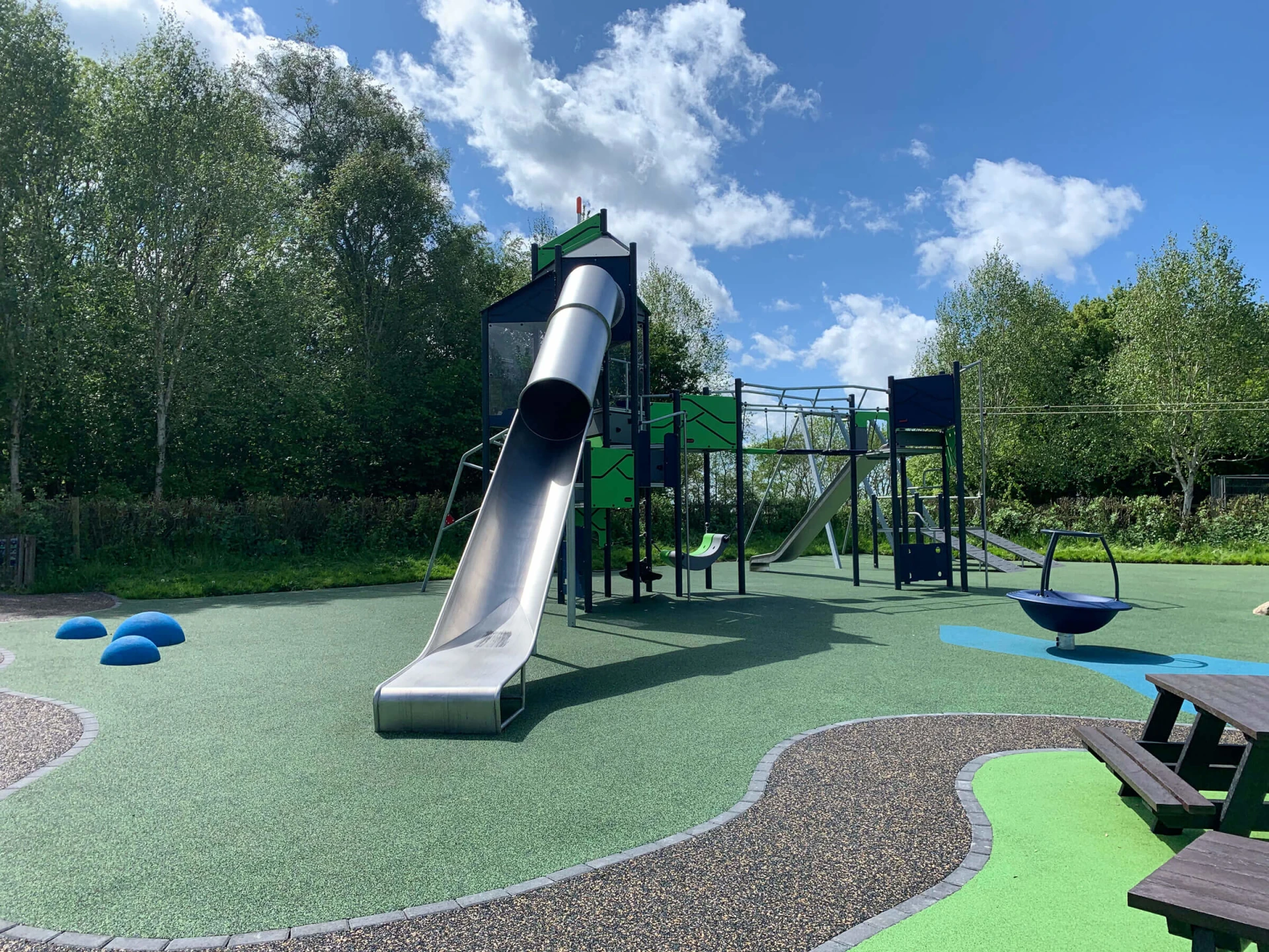 playtower with net bridge and slide in a park