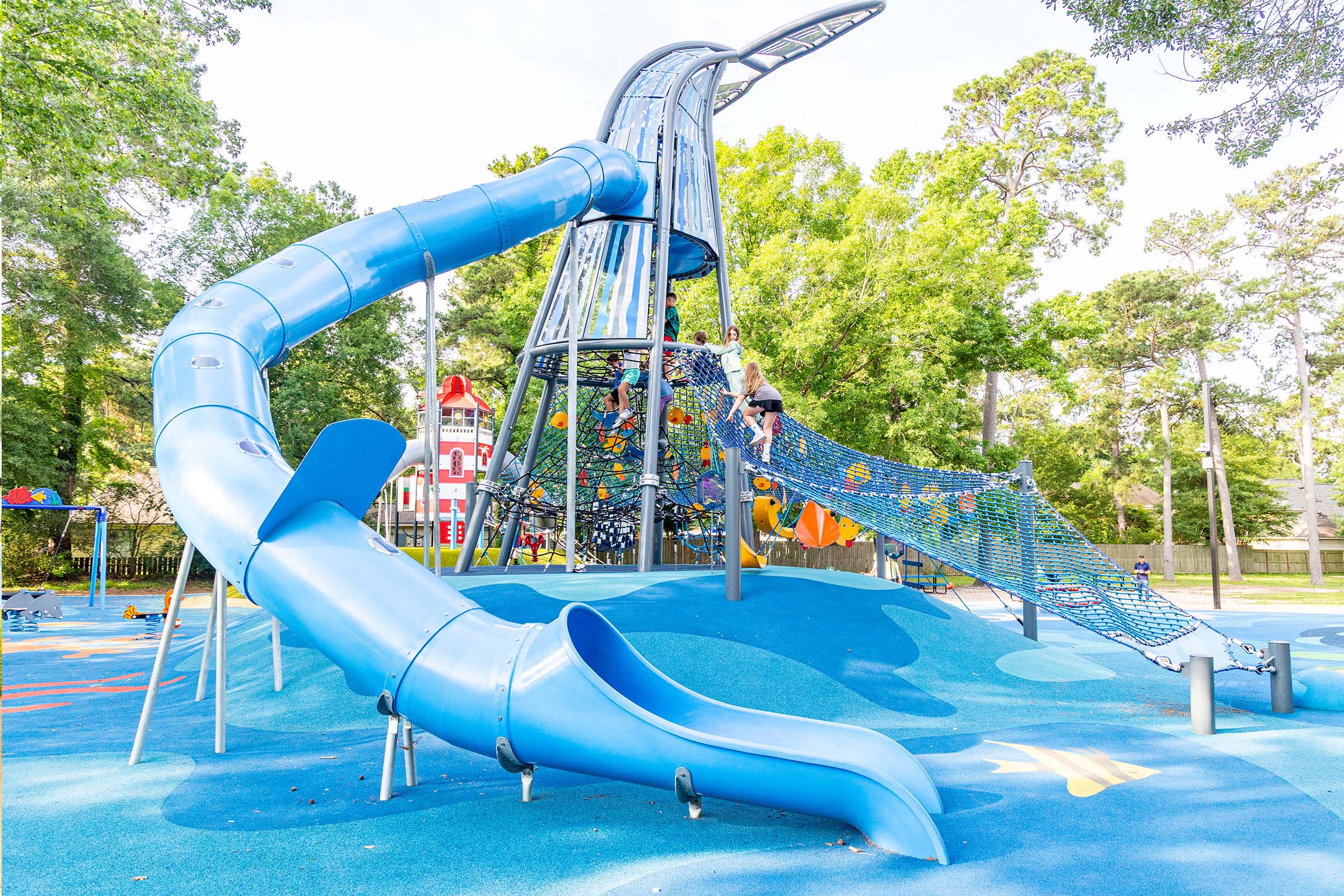 Children playing on ocean-themed playground