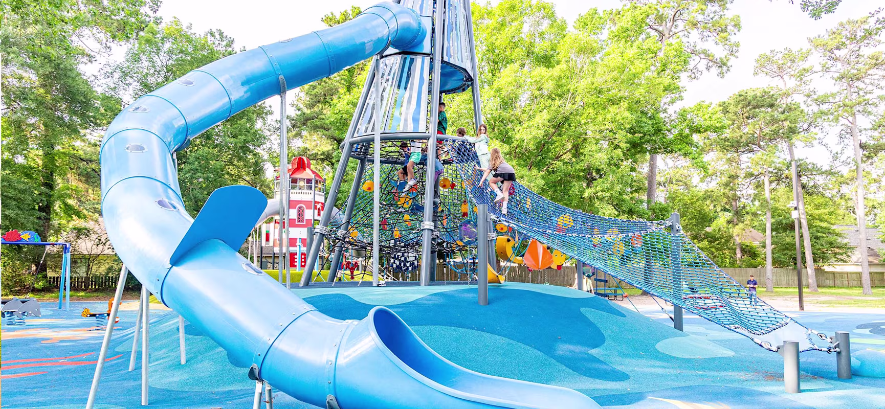Children playing on ocean-themed playground